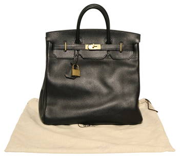 COUTURE. Hermes HAC 50 Travel Bag.: A large Hermes Haut a Courroies travel bag in black with gold tone hardware. Accompanied by a dust bag and keys to the interior of the bag tag. From a Newtown, CT estate. Dimensions: measures approx.