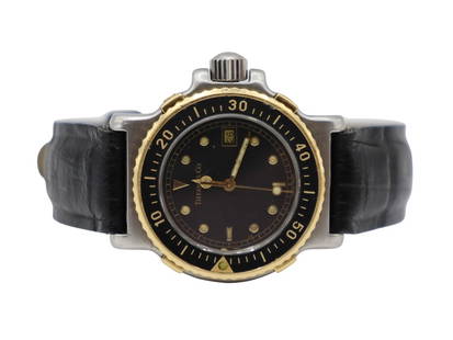 JEWELRY. Tiffany & Co. Two-tone Diver Quartz Watch: A lady's Tiffany & Co. stainless and 18kt yellow gold diver quartz watch Ref #: L0720. This watch by Tiffany & Co. features a 32mm stainless round case (excluding crown), sapphire crystal, bla