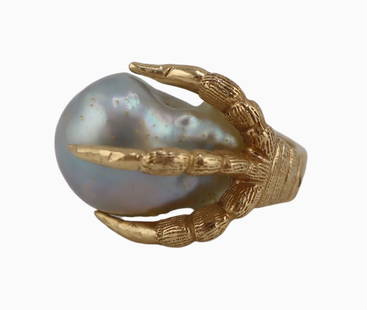 JEWELRY. 14kt Gold and Baroque Blue Pearl Ring.: 14kt yellow gold figural ring displaying a baroque blue pearl grasped within a striated three clawed foot. Stamped, "14K" within the interior of the band. Total approx. weight of the ring is