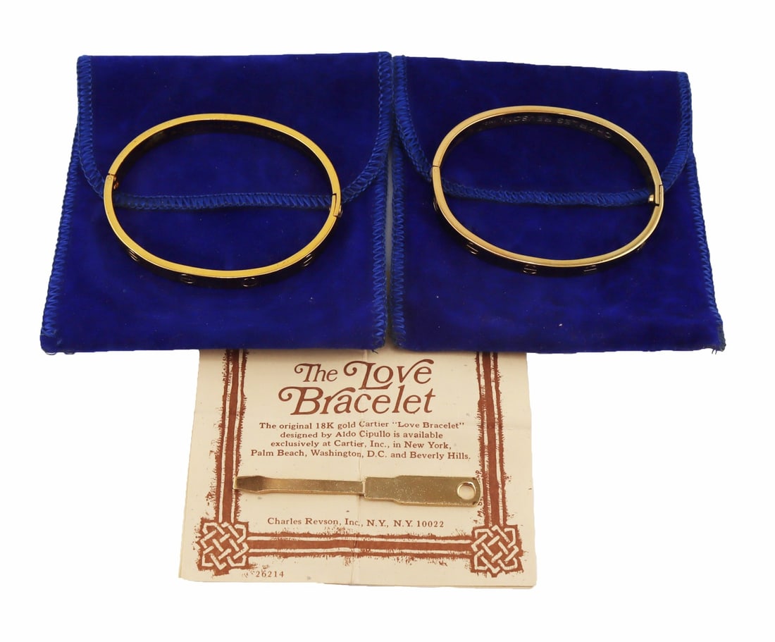 JEWELRY. (2) Charles Revlon Inc. "Love" Bracelets.: Includes (2) Charles Revlon Inc. gold electroplate "Love" bracelets. Accompanied by (2) original dust bags, (1) screwdriver, and a "The Legend of The Love Bracelet" pamphlet. Interior of the bracelets