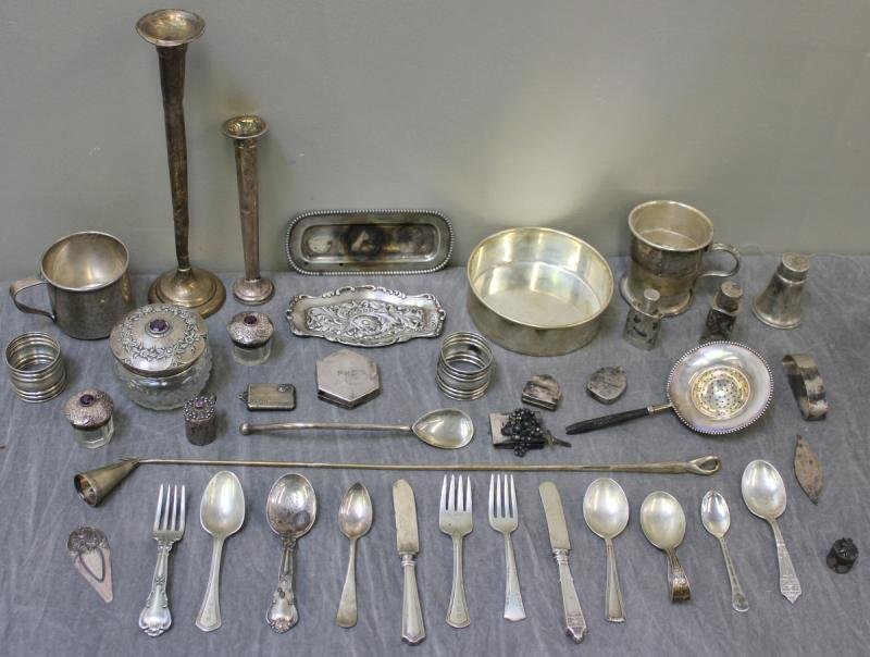 STERLING. Miscellaneous Lot.: Includes a cup, a folding travel cup, a low bowl, tea strainers, napkin rings, small trays, Kirk money clip, Tiffany & Co. money clip?, Italian candle snuffer, perfume bottles, Tiffany tape measurer, 