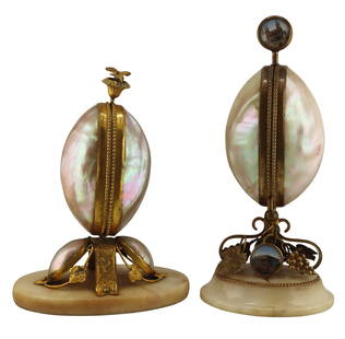 19th Century Grand Tour Egg Form Hinged Etui.: French 19th century Grand Tour mother-of-pearl egg form etui. With spring loaded closure which opens to reveal a fitted interior displaying a silver mounted scent bottle, needle holder, needle, scisso