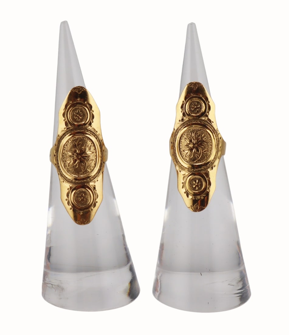 GOLD. (2) Signed Swedish 18kt Gold Finger Guards.: Includes (2) signed Swedish 18kt yellow gold finger guards or protectors displaying etched foliate and scroll designs. Stamped, "18K" with an unidentified maker's mark of, "IP" set