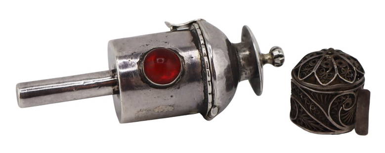 SILVER. (2) Unusual Antique Silver Sewing Objects.: Includes an antique 19th century silver Batavian? filigree petite tape measure; and a monogrammed Victorian railroad lantern form etui with bezel set red cabochon - opens to reveal a pierced surround