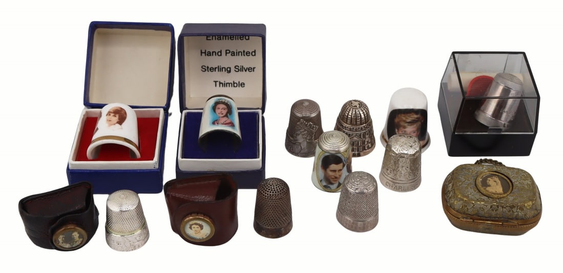 SILVER. Collection of Royal Family Sewing Objects.: Includes a bone China Princess Diana thimble; a Victorian hinged thimble case on chain displaying an image of Queen Victoria; a Sheer Elegance Prince Charles and Princess Diana cased porcelain thimble