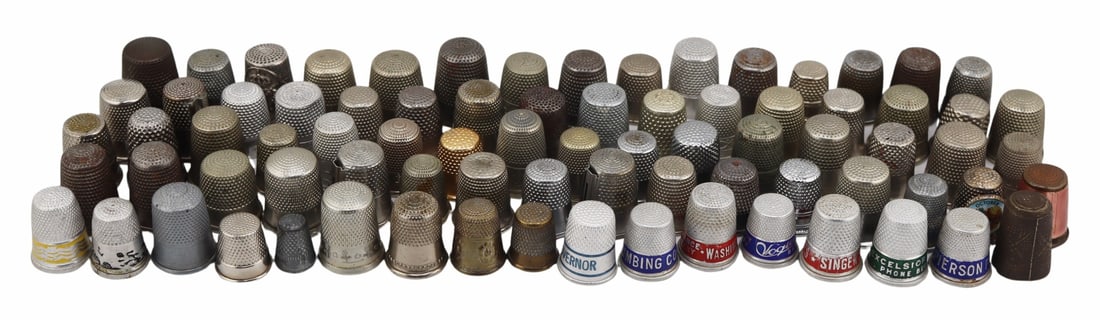 (81) Assorted Metal Thimbles Inc. Advertising.: Includes a total of (81) assorted metal thimbles - most silver-tone but including (7) enamel decorated advertising examples; and (1) pink guilloche enamel decorated brass thimble. From the estate of J