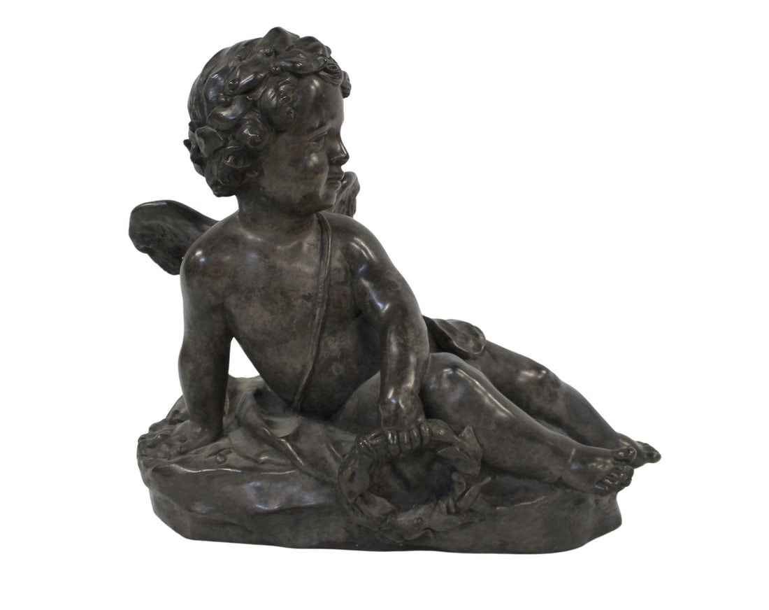 Antique Bronze Sculpture Of A Reclining Cherub.: Apparently unsigned, good size and with great patina. From a Westside NYC estate. - Dimensions: 13" h x 14.5" w x 9.5" d