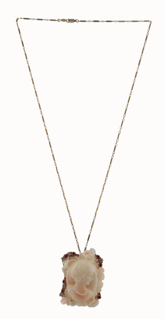 JEWELRY. 14kt Gold Angel Skin Coral, Ruby and: Diamond Pendant. Vintage 14kt yellow gold mounted carved angel skin coral high relief cameo of a beauty with a surround of roses and leaves, and further accented by a total of (7) round faceted rubies