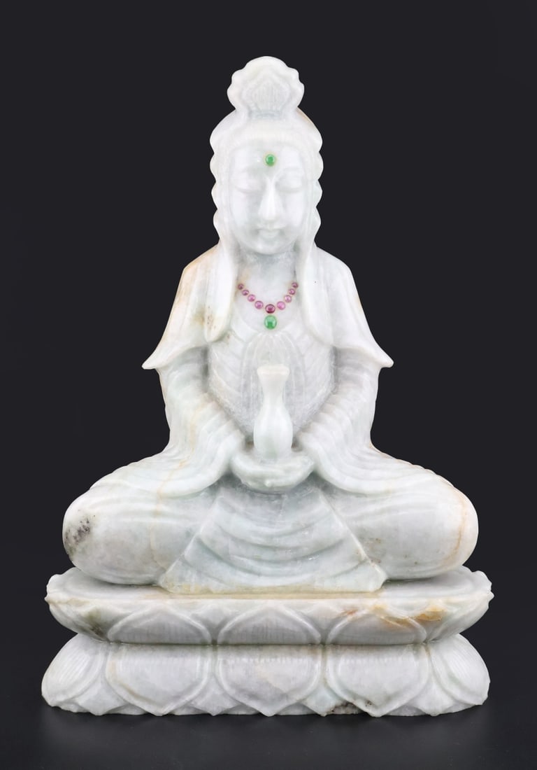 Asian Jade Guanyin with Rubies.: A carving of a seated Guanyin atop a double lotus base holding a vase with a necklace of rubies and jade. Total approx. weight of figure is 1842.5 g (gross). From a Scarsdale, NY estate. Dimensions: m