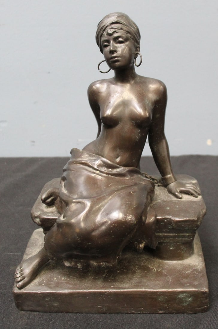 Emmanuel Villanis (1858-1914, France) Bronze: "Slave Girl in Chains". Girl in turban in iron manacles chained to bench. Her skirt is removable. Wearing large hoop earrings. Signed on the side of the bench "E. Villanis". - Dime