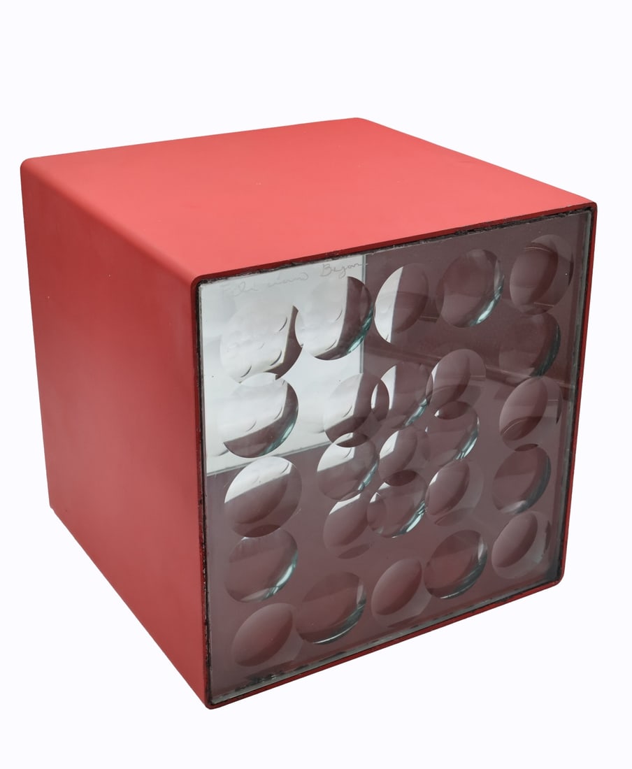 AFTER FELICIANO BEJAR.: 'Red Magiscope' Cube. Enameled steel and cut glass. Property of a Bronx, NYC collection. Dimensions: 10" x 10.125 cubed.
