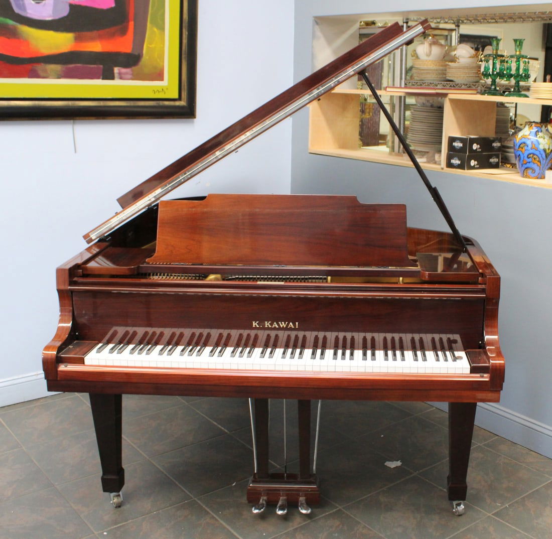K.KAWAI Baby Grand Piano Model: Comes with bench and appears to be in good condition. From a Scarsdale NY estate Dimensions:39.75" h; 57.5" w; 71" l.
