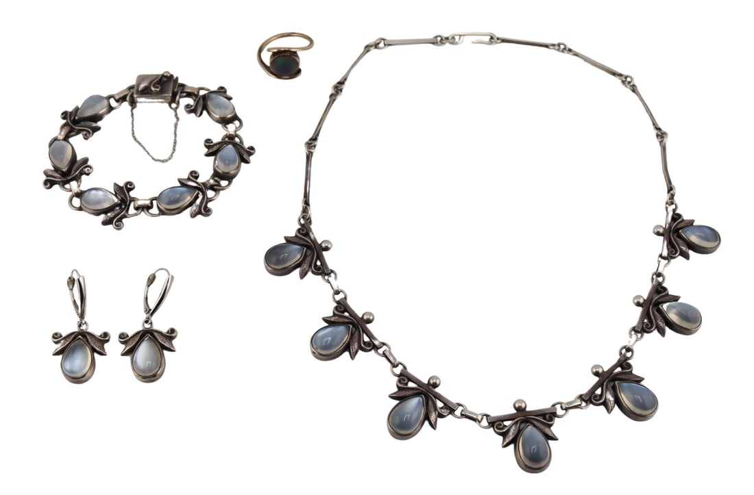 JEWELRY. Moonstone Jewelry Inc. Laurence Foss.: Includes a 4 pc. signed Laurence Foss sterling and moonstone suite of a necklace, bracelet and a pair of earrings - the necklace is stamped, "Sterling 416 1/2", and the bracelet is stamped,