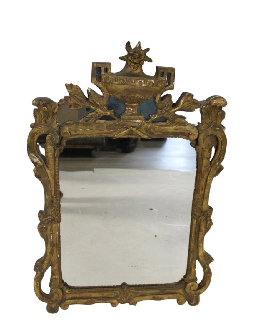 Antique Continental Carved Giltwood Mirror.: Good age, carved with flowers and urn crown. From a Flushing Queens NY estate. - Dimensions: 36" x 24"