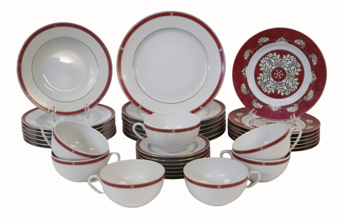 CHRISTOPHLE. Oceana Rouge Aida Porcelain.: To include: 7 Plates (10.5"), 7 plates with pattern (8.75"), 7 rimmed soup bowls (9"), 7 cups with saucers. From a West 65th St NYC estate.