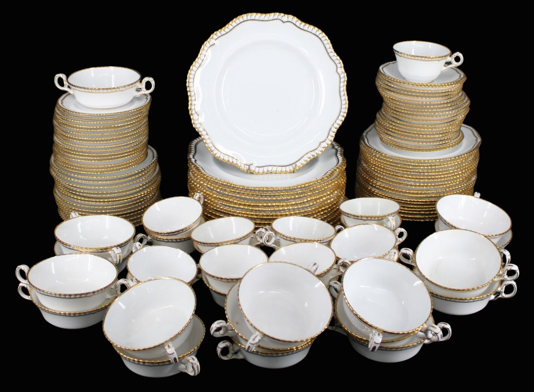 Set Of Spode Gilt Trim Porcelain Service.: To include 13 plates (10.5"), 18 plates (8"), 16 plates (6"), 17 two-handled cups (6.5"), 19 saucers (5.75"), 17 cups, and 14 saucers (7"). From a Garden City LI estate.