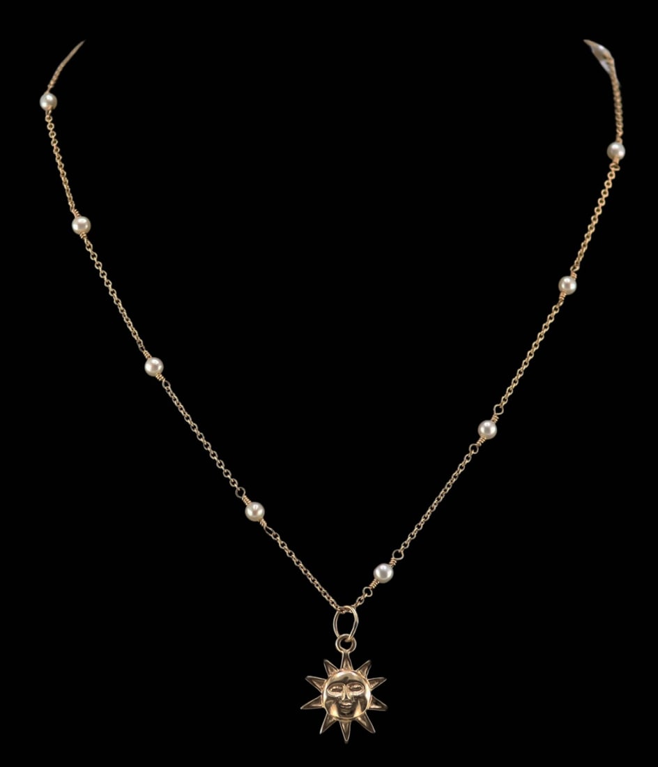 JEWELRY. 12.5kt Sun Pendant and 13.5kt Gold and: Pearl Chain Necklace. 13.5kt yellow gold chain necklace accented by pearl spacers and suspending a 12.5kt yellow gold sun form pendant. Total approx. weight of the chain is 2.7 dwt (gross); total appr