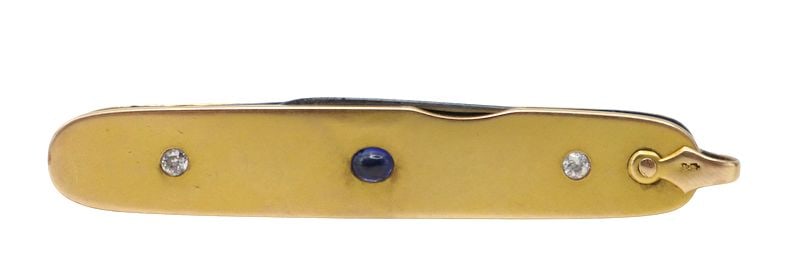 GOLD. 14kt Gold Sapphire and Diamond Pocket Knife.: A monogrammed 14kt yellow gold jacketed metal pocket knife with (2) steel blades, featuring a centrally flush-mounted Sapphire cabochon accent flanked on each side by a flush-set diamond accent. Shack