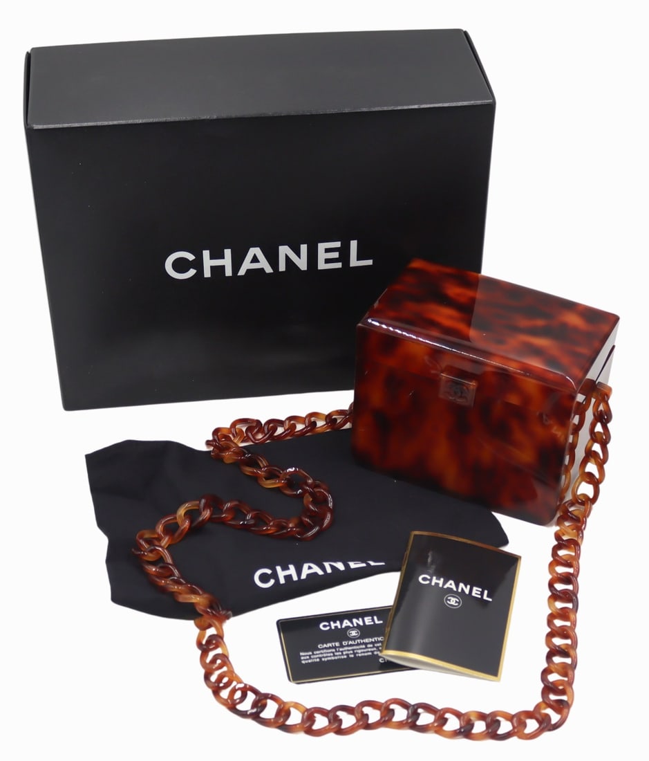 COUTURE. Chanel Faux Tortoiseshell Mini Box Bag.: Chanel faux tortoiseshell mini box bag purse on chain. Accompanied by a Chanel box, dust bag, authenticity card, and Chanel pamphlet. From a Great Neck, NY estate. Dimensions: purse measures approx. 5