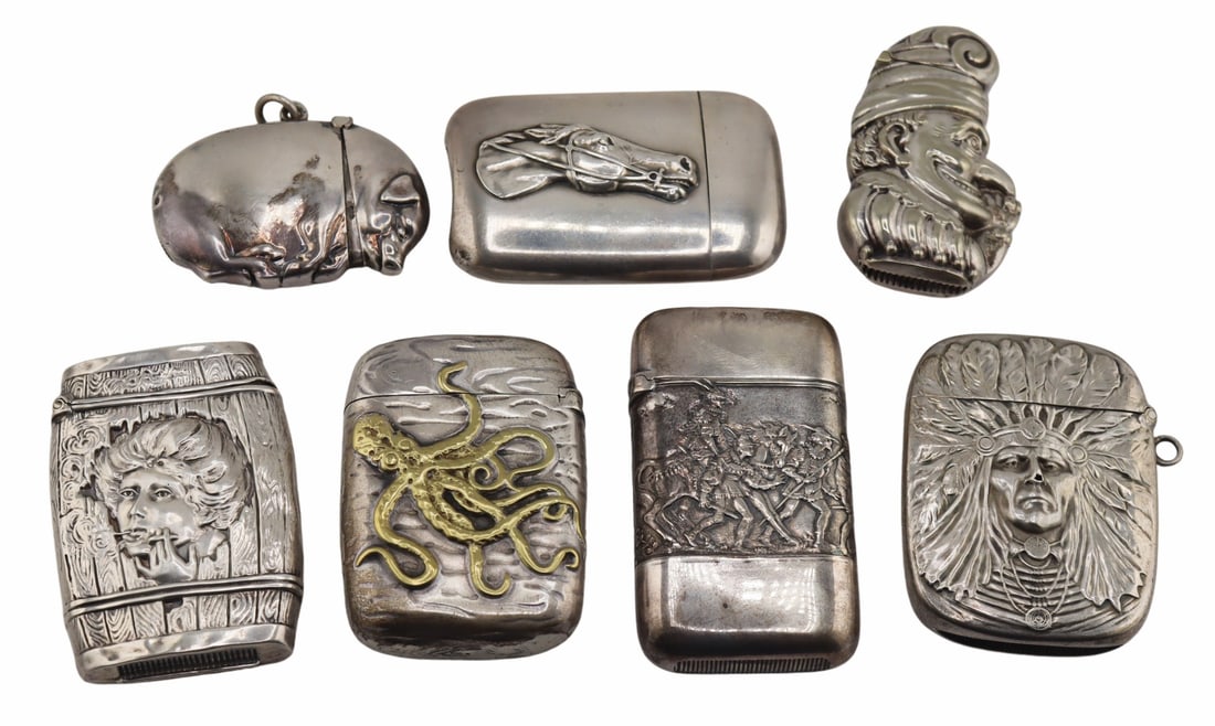 SILVER. (6) Silver Vesta/Match Cases Inc. Gorham.: Includes a .900 silver hinged pig vesta/match case - stamped, "900" and, "129 0"; a Gorham sterling/mixed metal vesta/match case with applied octopus - stamped, "Sterling 415&