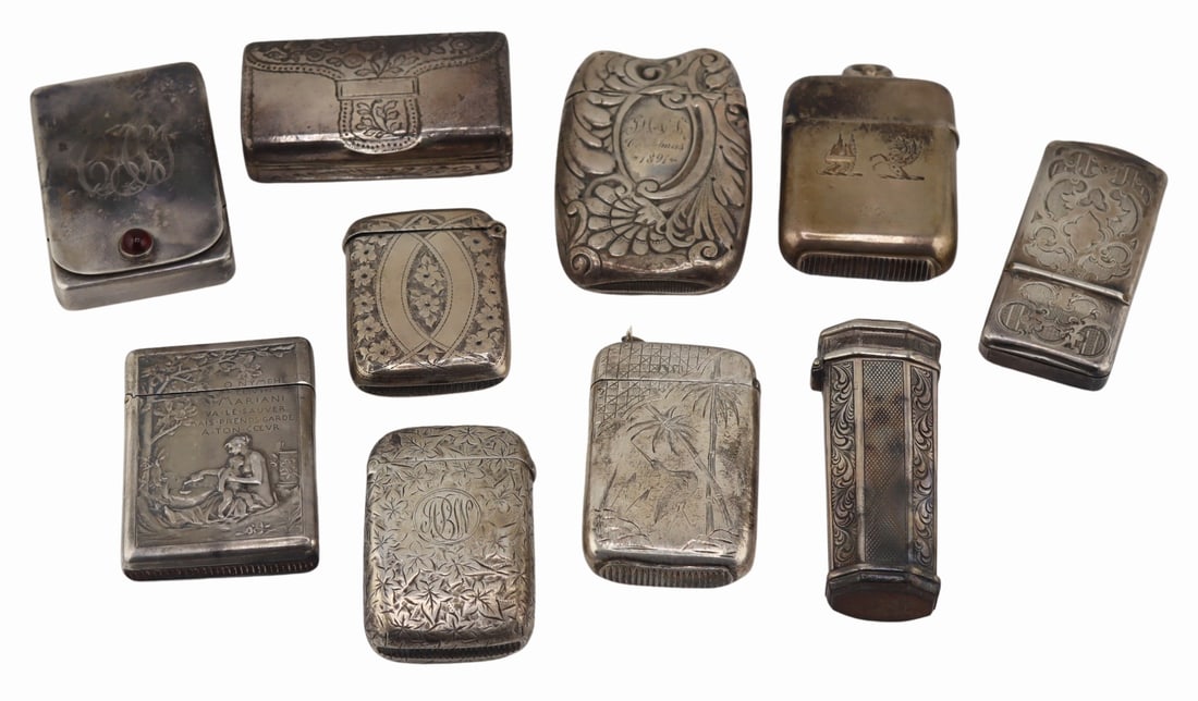 SILVER. Collection of (10) Vesta/Match Cases.: Includes a monogrammed hinged case with circular red cabochon; a monogrammed English silver hinged vesta/match case with ivy decoration - Birmingham, maker of S&I?; an English silver vesta/atch ca