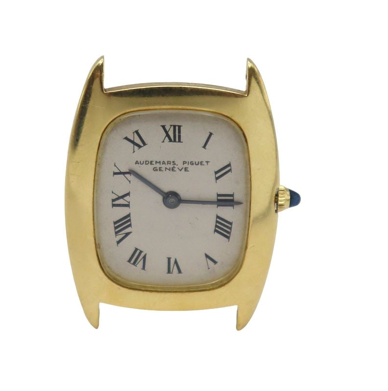 JEWELRY. Vintage Audemars Piguet 18kt Gold Watch.: Vintage Audemars Piguet Ultra-thin 18kt yellow gold mechanical watch Ref #: 5233. This watch by AP features an 18kt yellow gold 26.50 mm (excluding crown) ultra-thin oval-tonneau or cushion case, glas