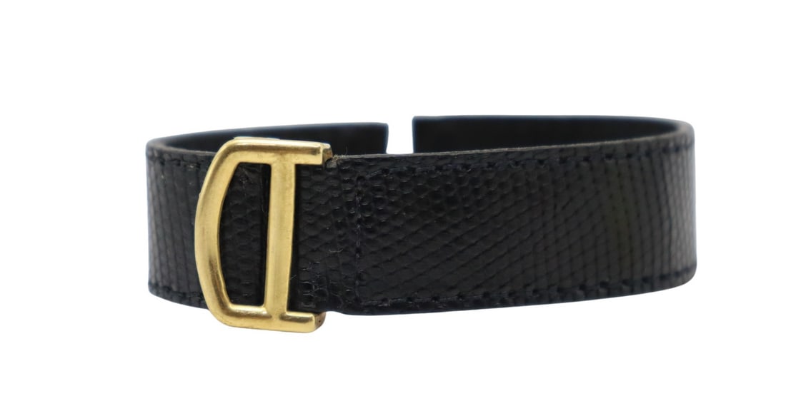 JEWELRY. Cartier 18kt Gold Deployment Clasp.: A Cartier 18kt yellow gold deployment clasp fitted with a Cartier two-piece leather strap. Total approx. weight of the deployment clasp is 7.5 dwt (gross) excluding the leather strap. From a Scarsdale