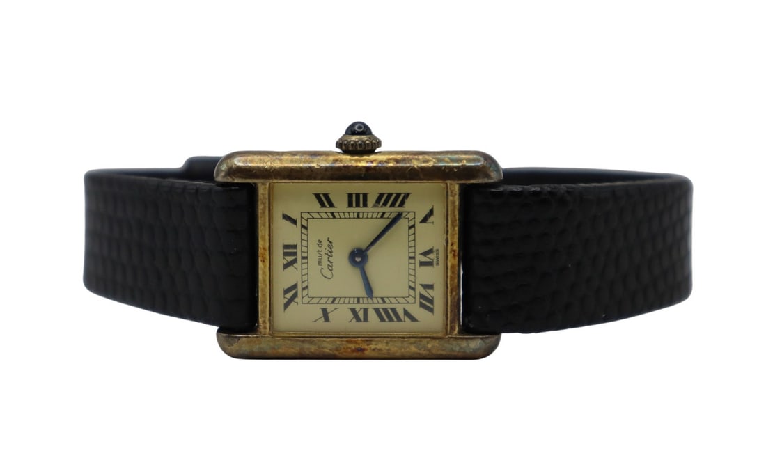 JEWELRY. Vintage Must De Cartier Vermeil Watch.: A lady's vintage Must de Cartier Tank vermeil mechanical watch. This watch by Cartier features 20 mm (excluding crown) vermeil tank watch case, glass crystal, off white dial, blued steel sword hands,