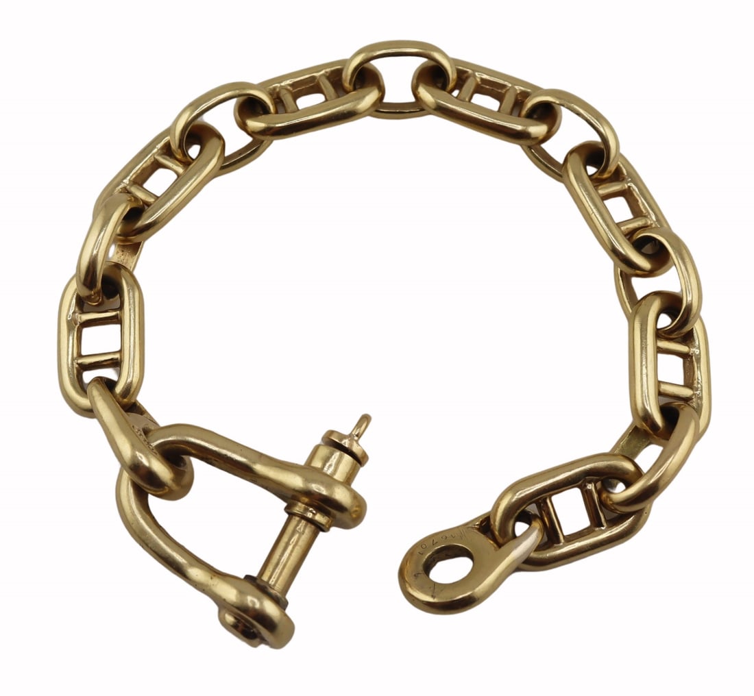 JEWELRY. Cartier 18kt Gold Link Bracelet.: Cartier 18kt yellow gold mariner's link bracelet with large horse bit clasp with screw closure. Stamped, "Cartier 18K", and "16701". Total approx. weight of the bracelet is 57.3 dw