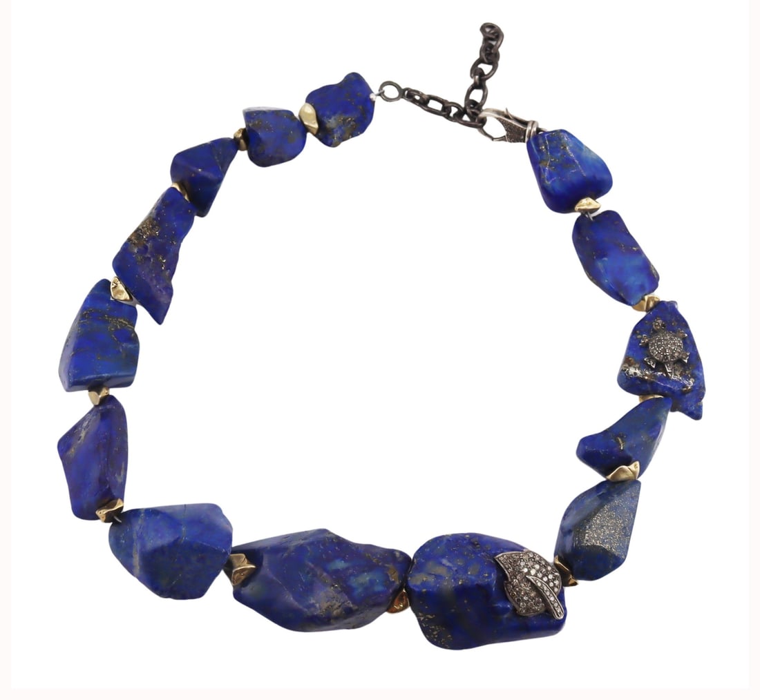 JEWELRY. Lapis Lazulis Silver and Diamond Necklace: Single strand Lapis Lazulis necklace with (1) applied pave diamond inlaid silver leaf pendant, (1) applied pave diamond inlaid silver turtle pendant, and gold-tone spacer beads. Additional pave diamon