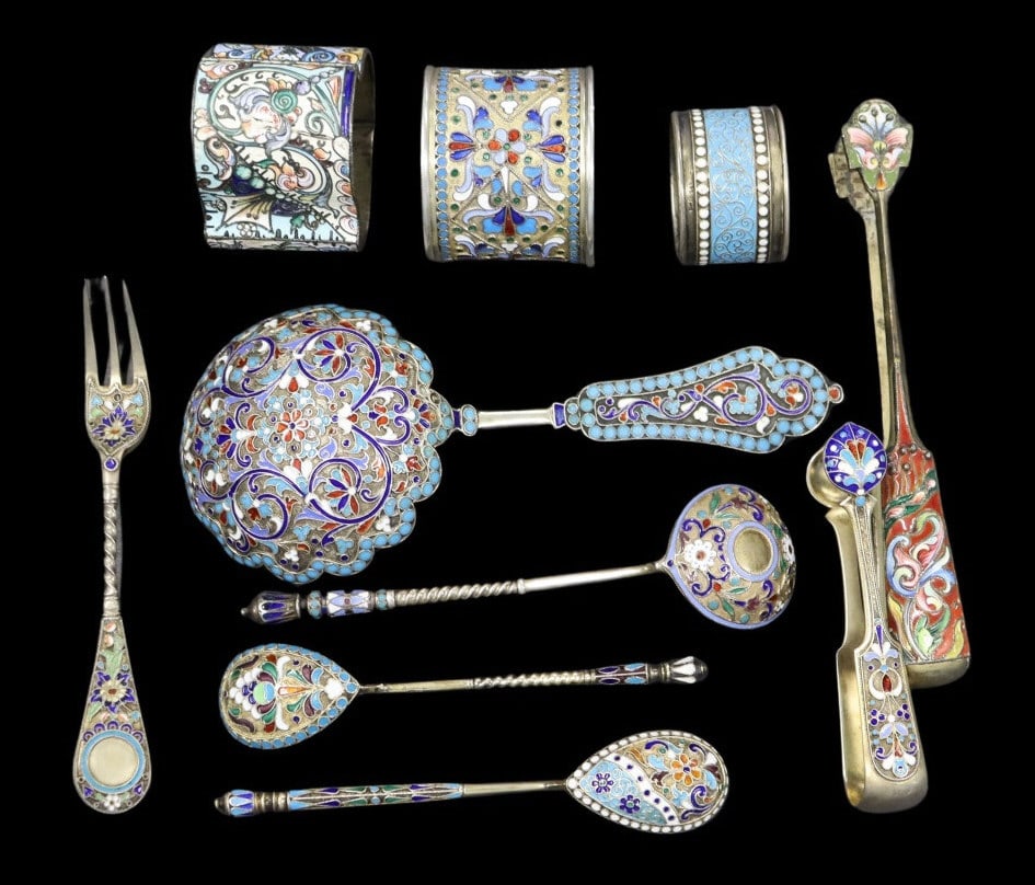SILVER Assorted Russian Silver and Enamel Flatware: Including a Russian .875 silver and enamel three-prong fork — stamped with an assay master’s mark of H.K., date of 1887, purity mark of 84 zolotniki, and a city mark of Moscow; a Russian .