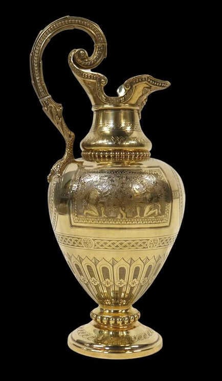 SILVER Victorian Gilt English Silver Ewer with: Bacchanalia Decoration. A finely crafted gilt English silver ewer, bearing a Sheffield city mark and date stamp of 1864, with an illegible maker’s mark. The base is engraved "Mappin Brothers, 222 Re