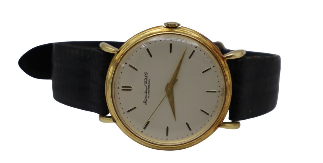 JEWELERY. Vintage IWC Schaffhausen 18kt Gold: Watch. A vintage men's IWC (International Watch Company) Schaffhausen 18kt gold mechanical watch. This watch by IWC features a Nardin & Cie 36 mm 18kt yellow gold round watch case, monogrammed cas