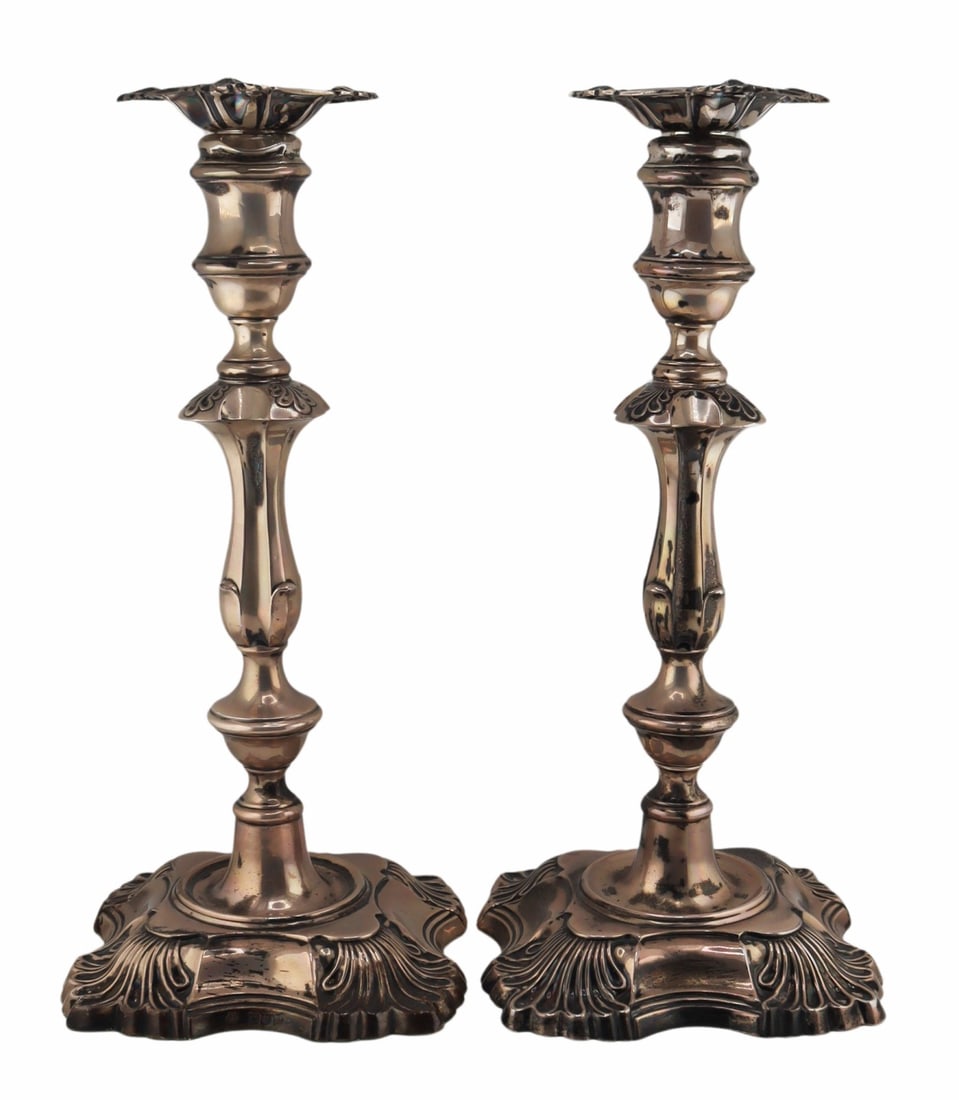 SILVER. Pair of William Hutton & Sons English: Silver Candlesticks. Pair of William Hutton & Sons English silver weighted candlesticks. London, William Hutton & Sons, 1900. From a Dobbs Ferry, NY estate. Dimensions: candlesticks measure ap