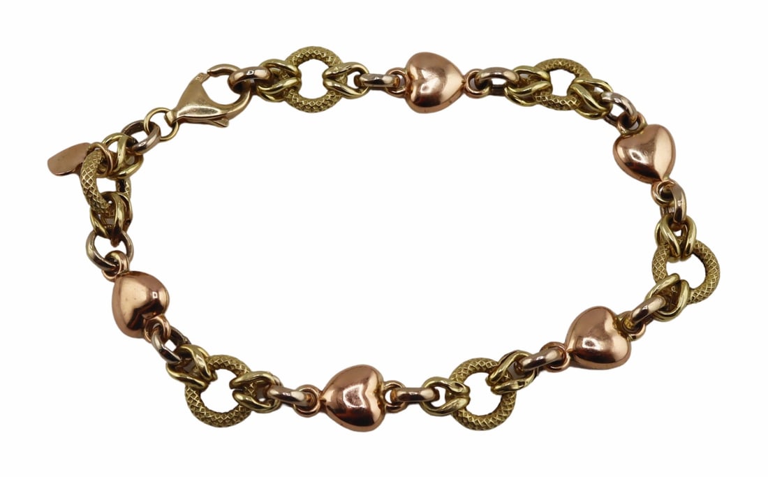 JEWELRY. Italian 14kt Bi-Color Gold Bracelet.: 14kt yellow gold and rose gold link bracelet with a heart motif. Displaying a heart form pendant stamped, "14K Italy" with an additional stamp of, "14K" to the clasp. Total approx.