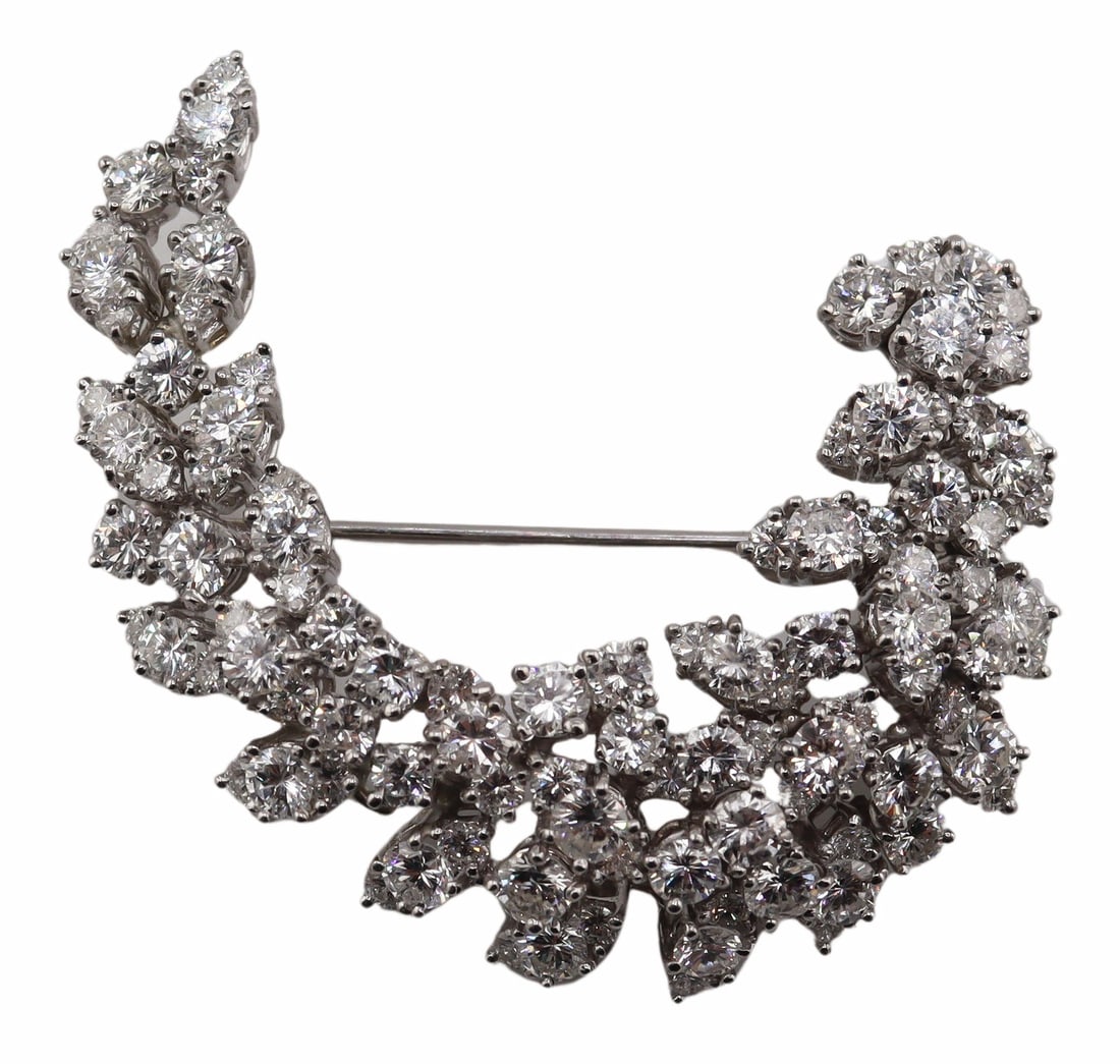 JEWELRY. Platinum and 9ct Diamond Foliate Brooch.: Platinum curved foliate form brooch displaying round full cut diamonds set in marquis form pendants reminiscent of leaves. Total of (52) round brilliant cut diamonds measuring approx. 3.5mm; total of