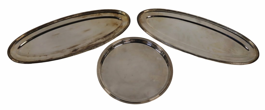 SILVERPLATE. (3) Christofle Silverplate Trays.: (3) Monogrammed Christofle silverplate serving trays. From a Mt Vernon, NY estate. Dimensions: round tray measures approx. 15.375" in diameter; oblong trays measure approx. 27.675" w x 10.75