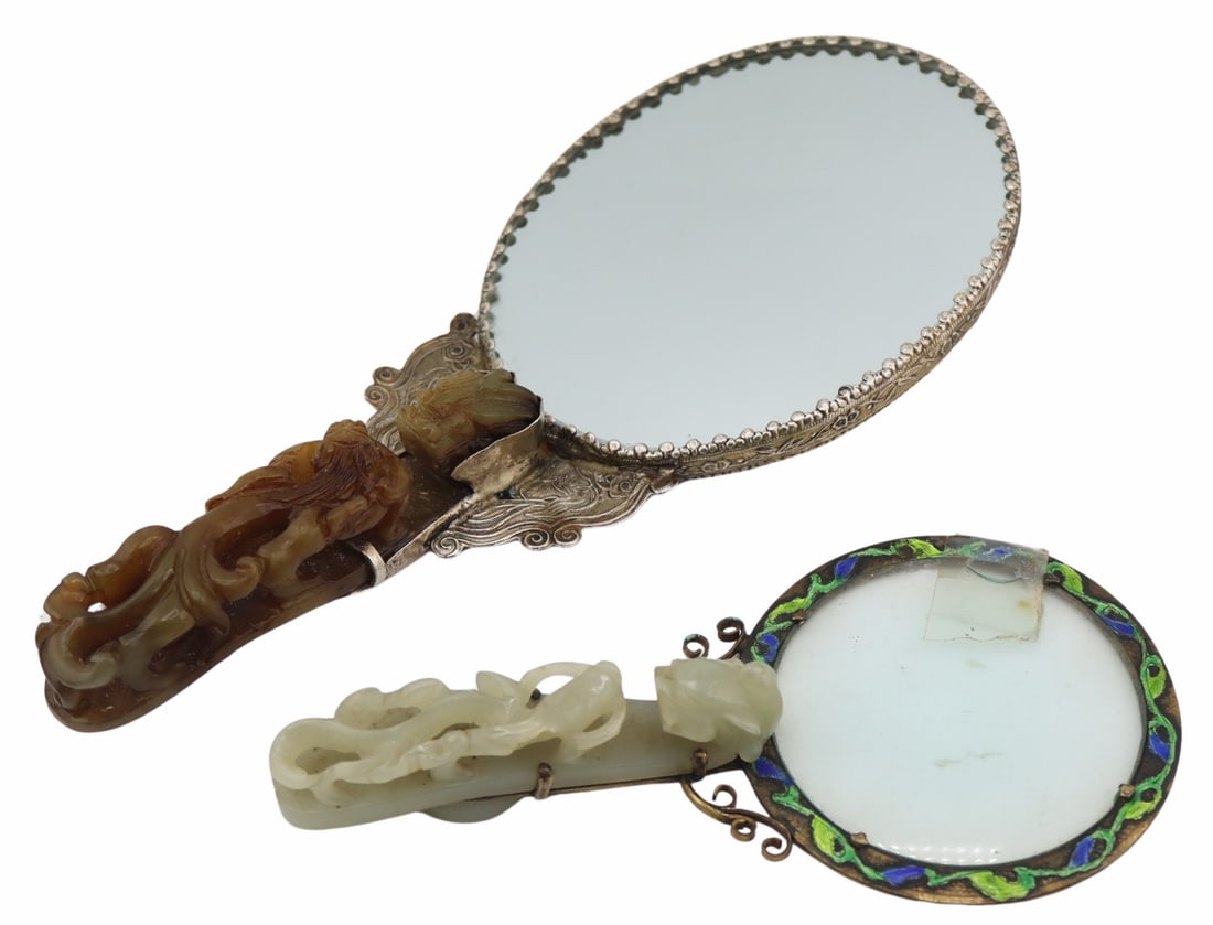 Chinese Carved Jade or Hardstone Belt Buckles.: Includes an antique Chinese carved jade dragon form belt buckle mounted as a magnifying glass with blue and green foliate form enamel decoration; and a Chinese carved hardstone dragon form belt buckle
