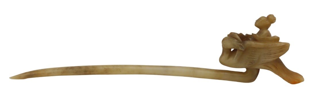 Chinese Carved Jade Hairpin of a Young Woman: Riding a Phoenix. Total approx. weight of the hairpin is 62.1 grams (gross). From an East Meadow, NY estate. Dimensions: hairpin measures approx. 8" in length.