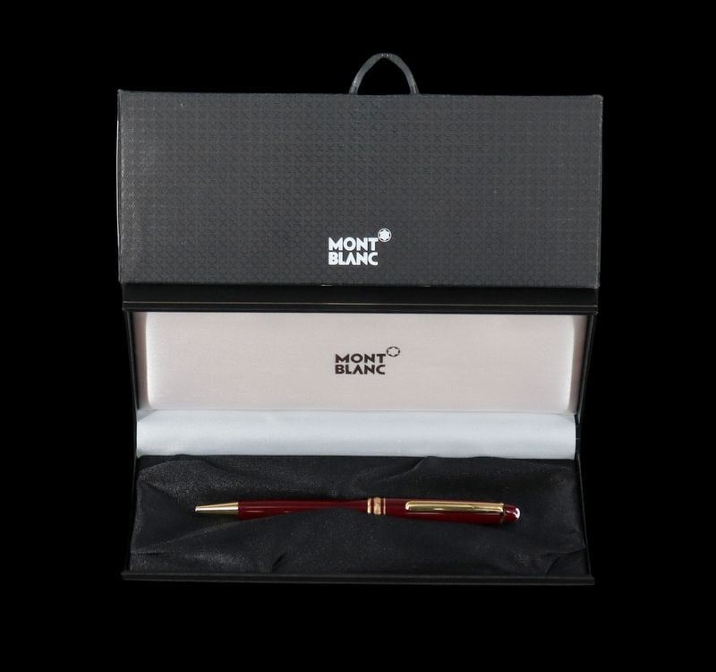Cased Montblanc Meisterstuck Classique Ballpoint.: A cased German Montblanc Meisterstuck Classique ballpoint pen Ref #: 164R. This pen features a resin body executed in Bordeaux (burgundy), and gold plated hardware. Accompanied by its original box and