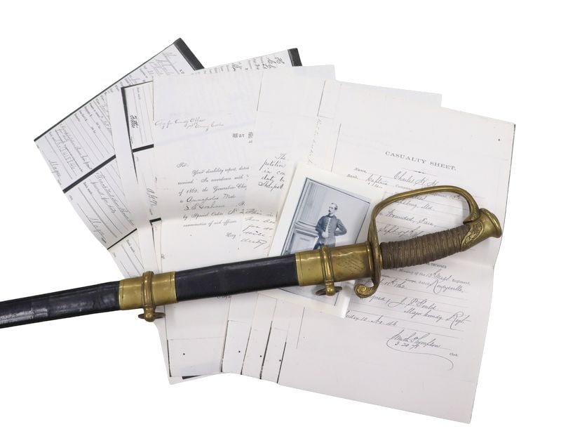MILITARIA. Named Civil War M.1850 Foot Officer’s: Sword. A Civil War Model 1850 Foot Officer’s Sword, complete with its matching leather scabbard, manufactured by the Christopher Roby Manufacturing Company of West Chelmsford, Massachusetts. The bla