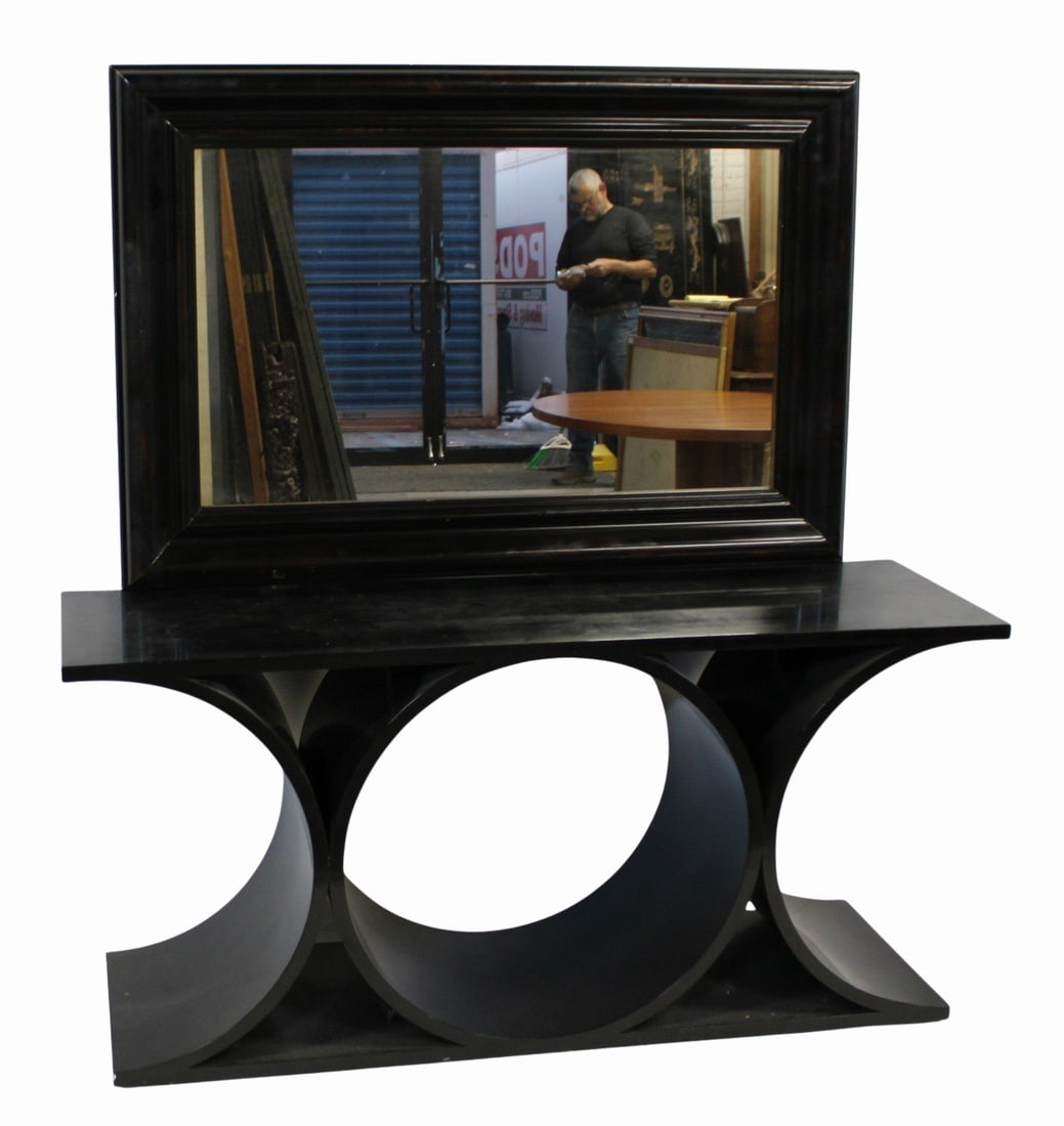 Vintage Karl Springer Mirror And Console: Ebonized console together with a faux shell mirror. From an upstate NY estate. Dimensions: Console 28" h x 60" w x 17.25" d & Mirror: 52.5" h x 35".