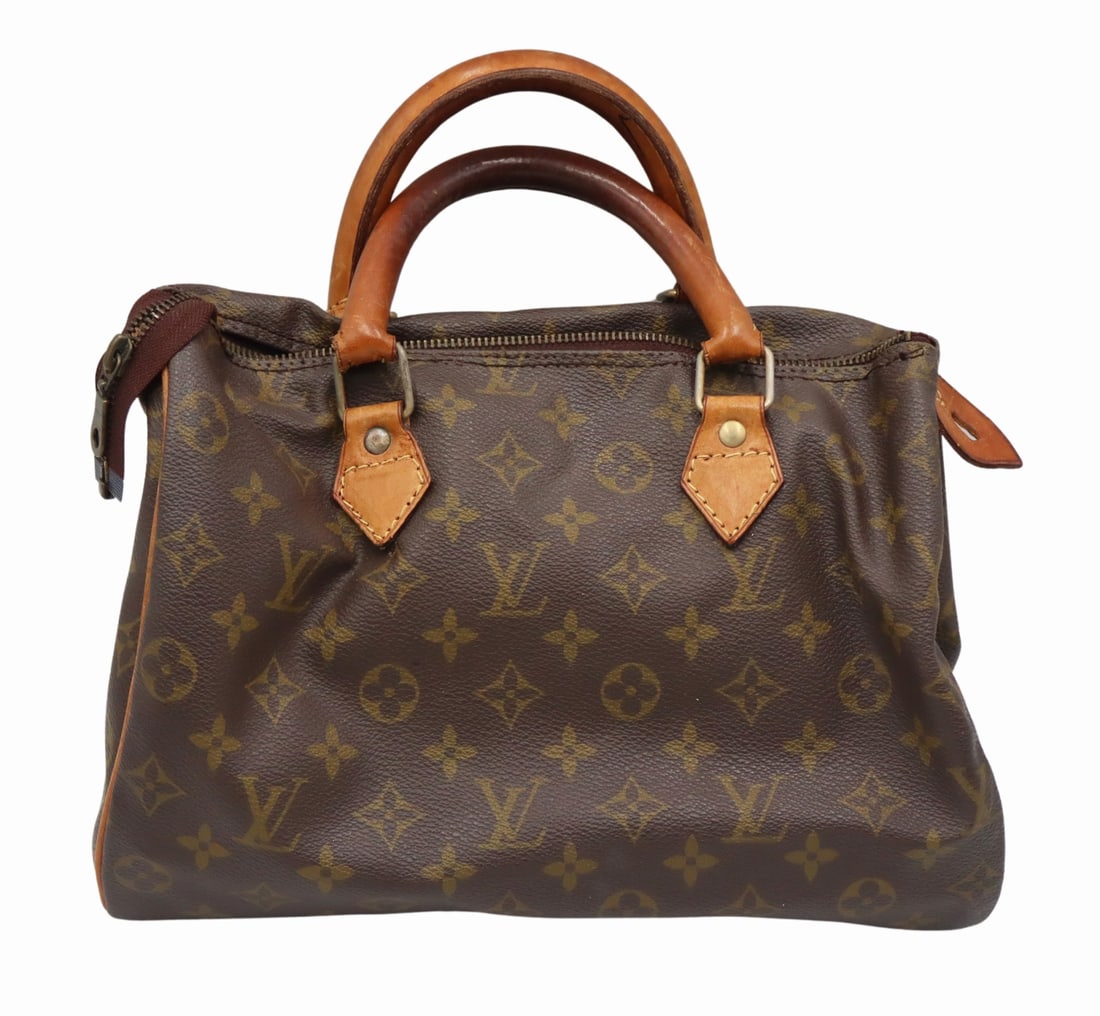 COUTURE. Vintage Louis Vuitton Monogram Purse.: From a Forest Hills, Queens estate. Dimensions: purse measures approx. 11.5" w x 6.5" w x 8" h; handle drop measures approx. 4" h.