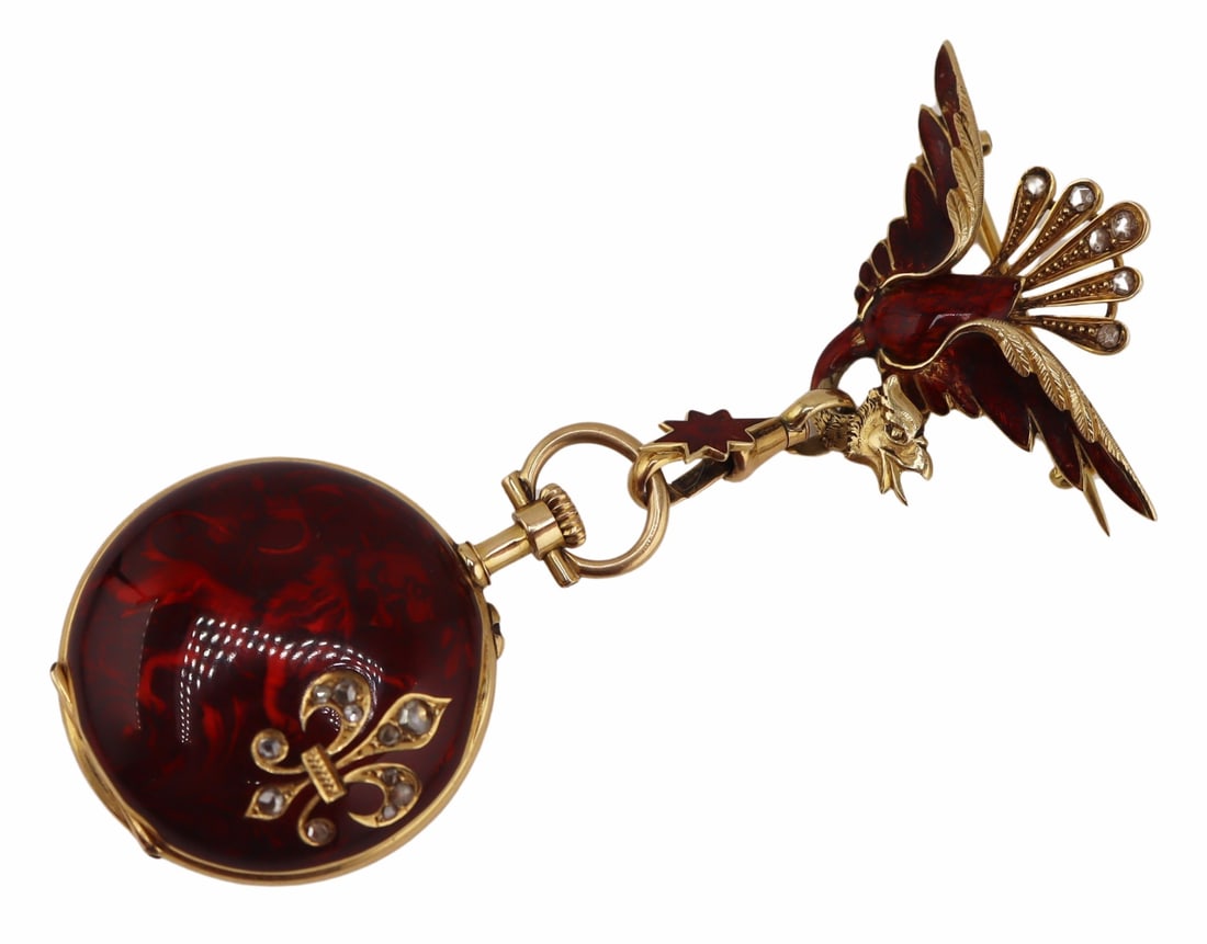 JEWELRY. Le Coultre & Cie 18kt Gold Phoenix Lapel: Watch. A well-executed lady’s Swiss 18kt yellow gold, guilloche, and diamond-accented open-face lapel watch pendant. This pocket watch features a guilloche enamel–decorated caseback and bezel, the