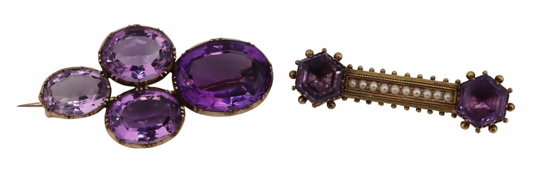 JEWELRY. (2) Victorian Amethyst Bar Pins.: Includes a Victorian gilt 9kt gold Etruscan Revival bar pin displaying (2) fancy cut amethysts flanking a central band of seed pearls - amethysts measure approx. 9.5mm x 10.0mm; and a Victorian 13kt g
