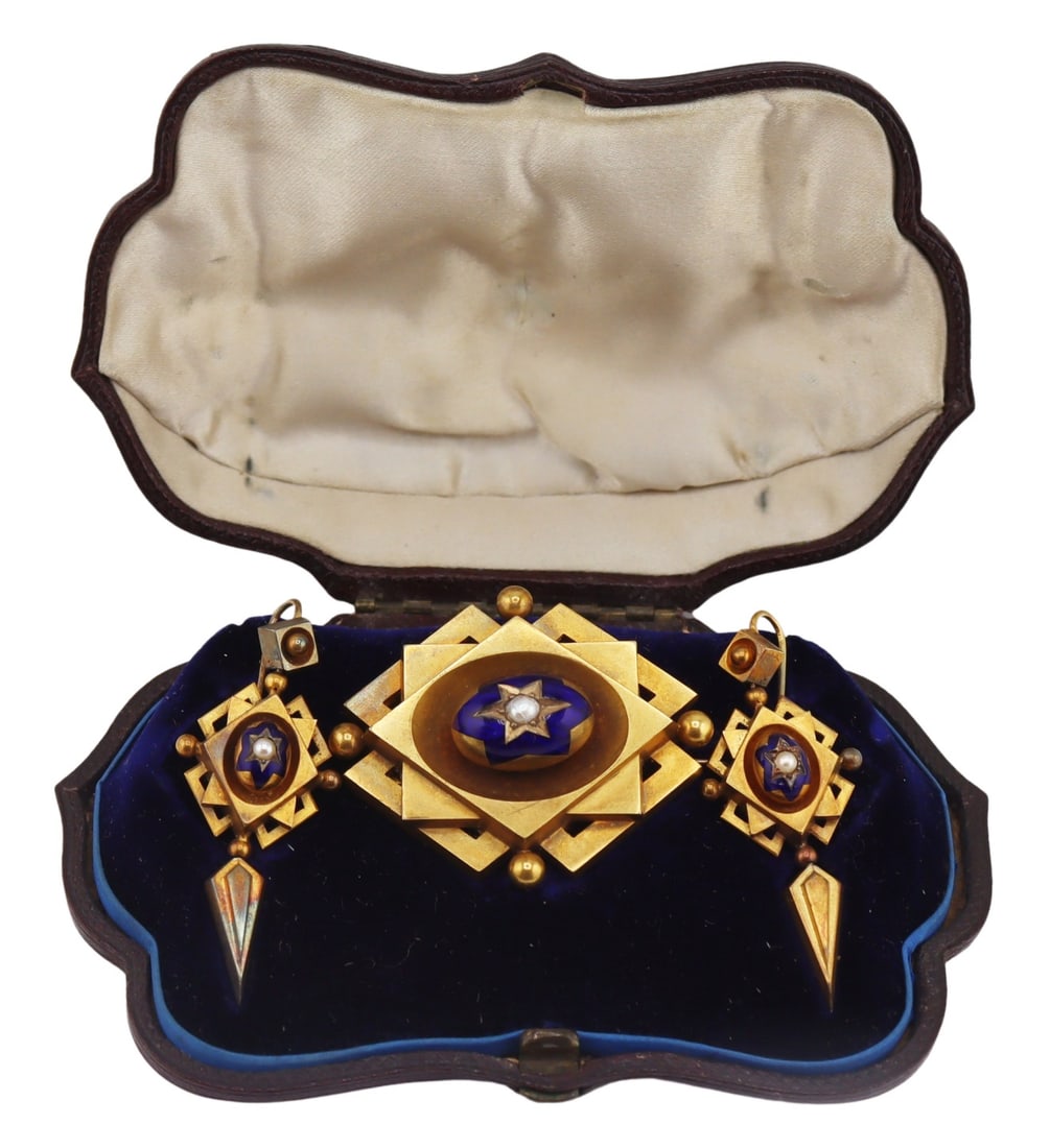 JEWELRY. 3 Pc. Victorian Enamel and Pearl Jewelry: Suite. Victorian geometric motif multi-tier gold brooch accented by a central cobalt blue enamel panel accented by a single pearl - with locket, necklace bail, and option for the addition of a drop pe
