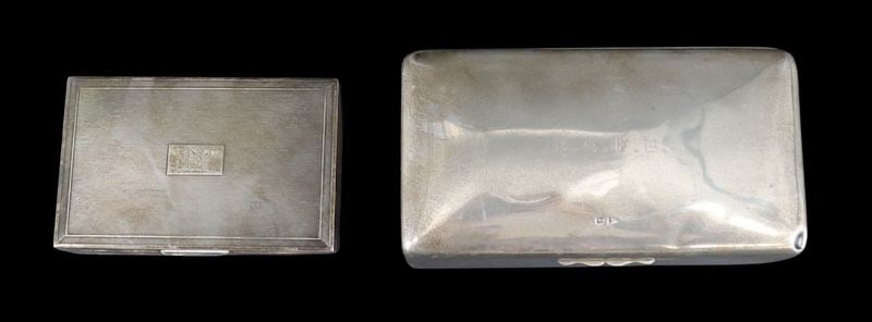 SILVER. (2) English Silver Cigarette Boxes.: An attractive grouping of (2) assorted hinged-lid, cigarette boxes each with a wood liner. Including a well executed English silver cigarette box with a Clous de Paris textured lid and a central crest