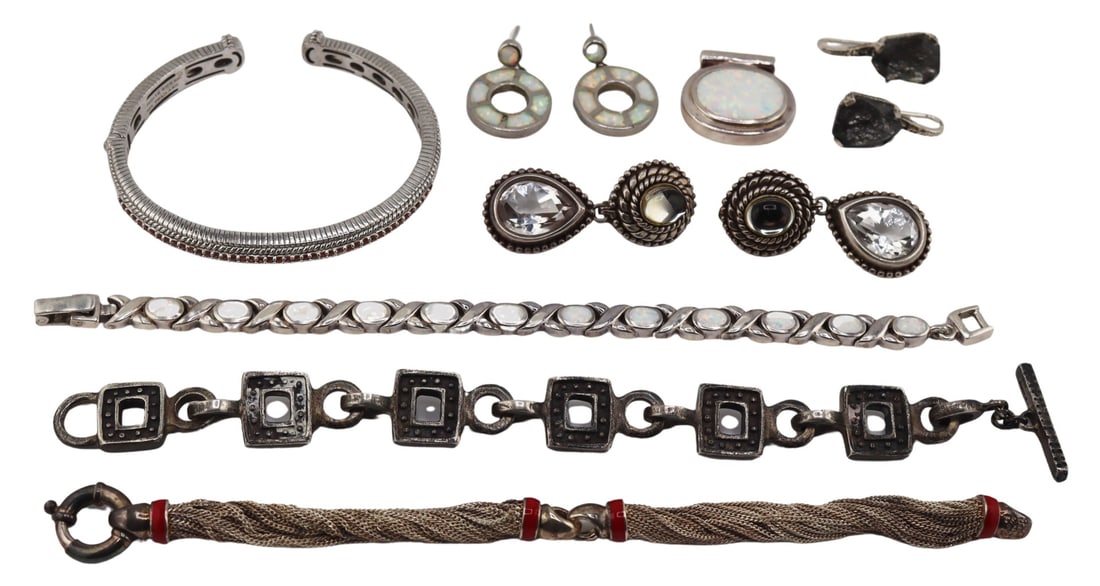 JEWELRY. Sterling Jewelry Inc T&Co, Dweck, Ripka.: Includes a Judith Ripka sterling and orange round faceted gem bracelet; a pair of Stephen Dweck sterling drop form earrings displaying oval clear cabochons, and pear faceted clear gems; a pair of Step
