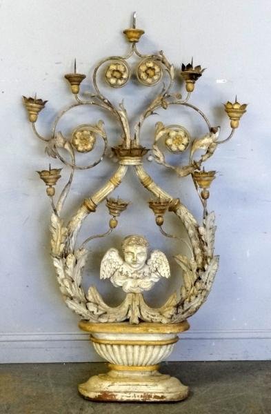 Large 18th/19th Century Continental Wood and: Tole Pricket Sconce, and Central Winged Cherub Figure. Original finish. From an Englewood, NJ estate. Dimensions: 30" wide x 56" high. Condition: Good, with some wood and tole bobeche detached.