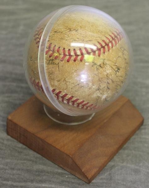 1950's Vintage New York Yankees Signed Baseball.: Signed Joe McCarthy, and many others. Circa the 1950's. In display stand. From a Port Chester, NY home. Dimensions: Stand - 3.25" w x 3.125" deep x 4.25" high. Condition: As found condition with fadin
